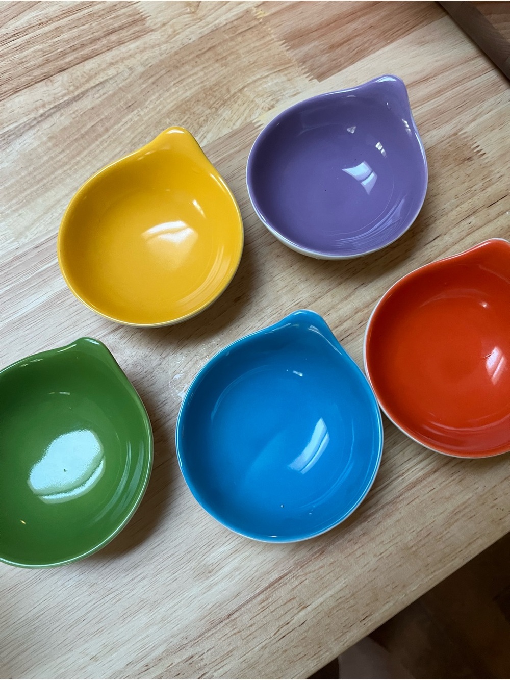 Set a five stacking condiment/sauce/dipping bowls.  Festive.